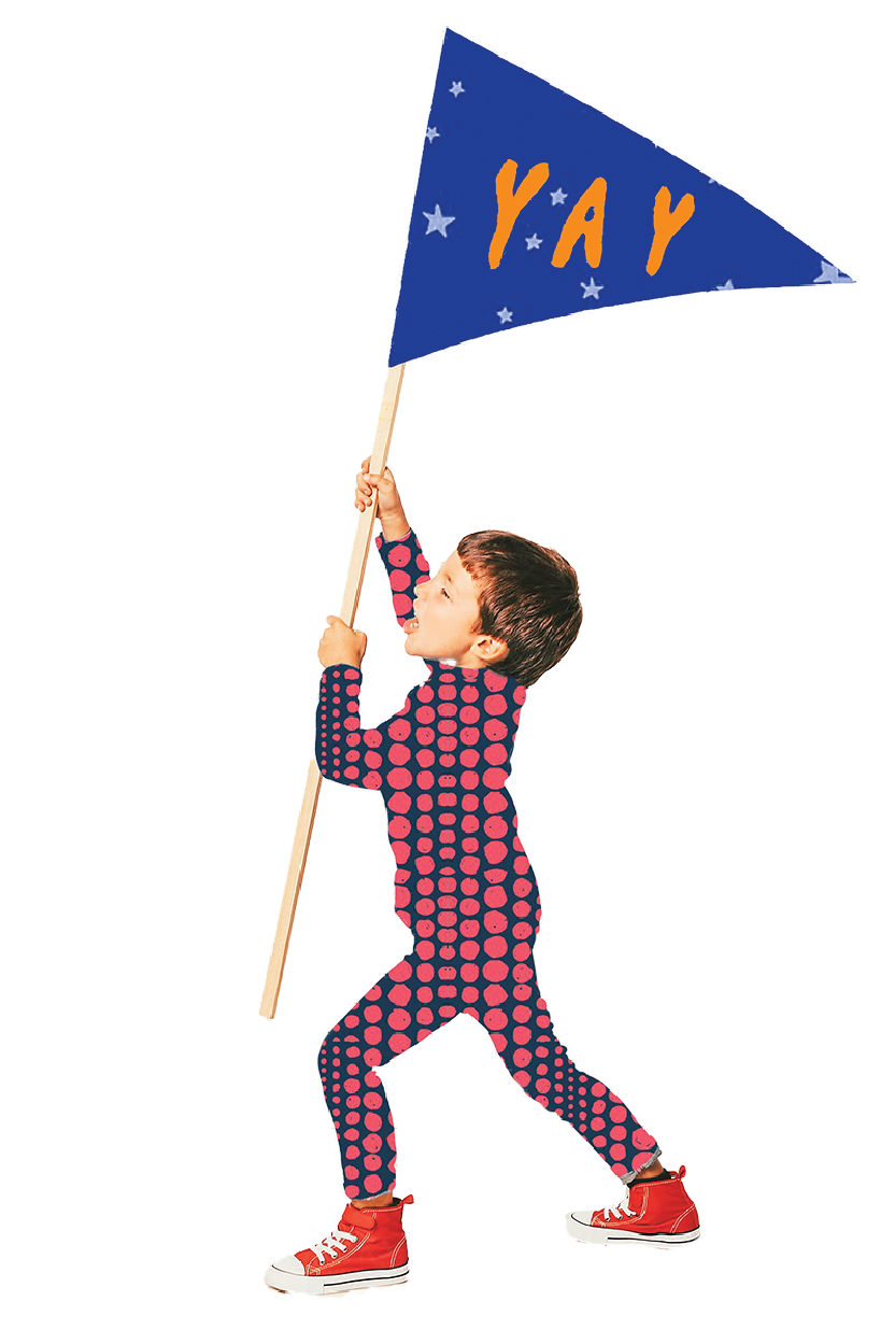 A young boy is holding a flag that says yay