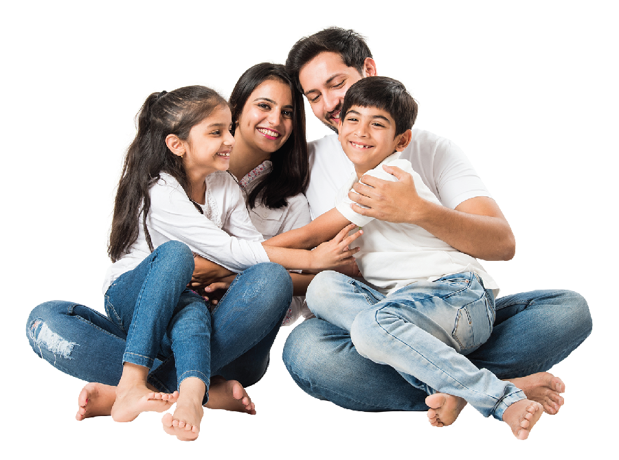 A family is sitting on the floor hugging each other.