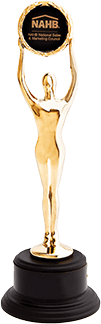 A gold statue of a woman holding a sign that says nahb