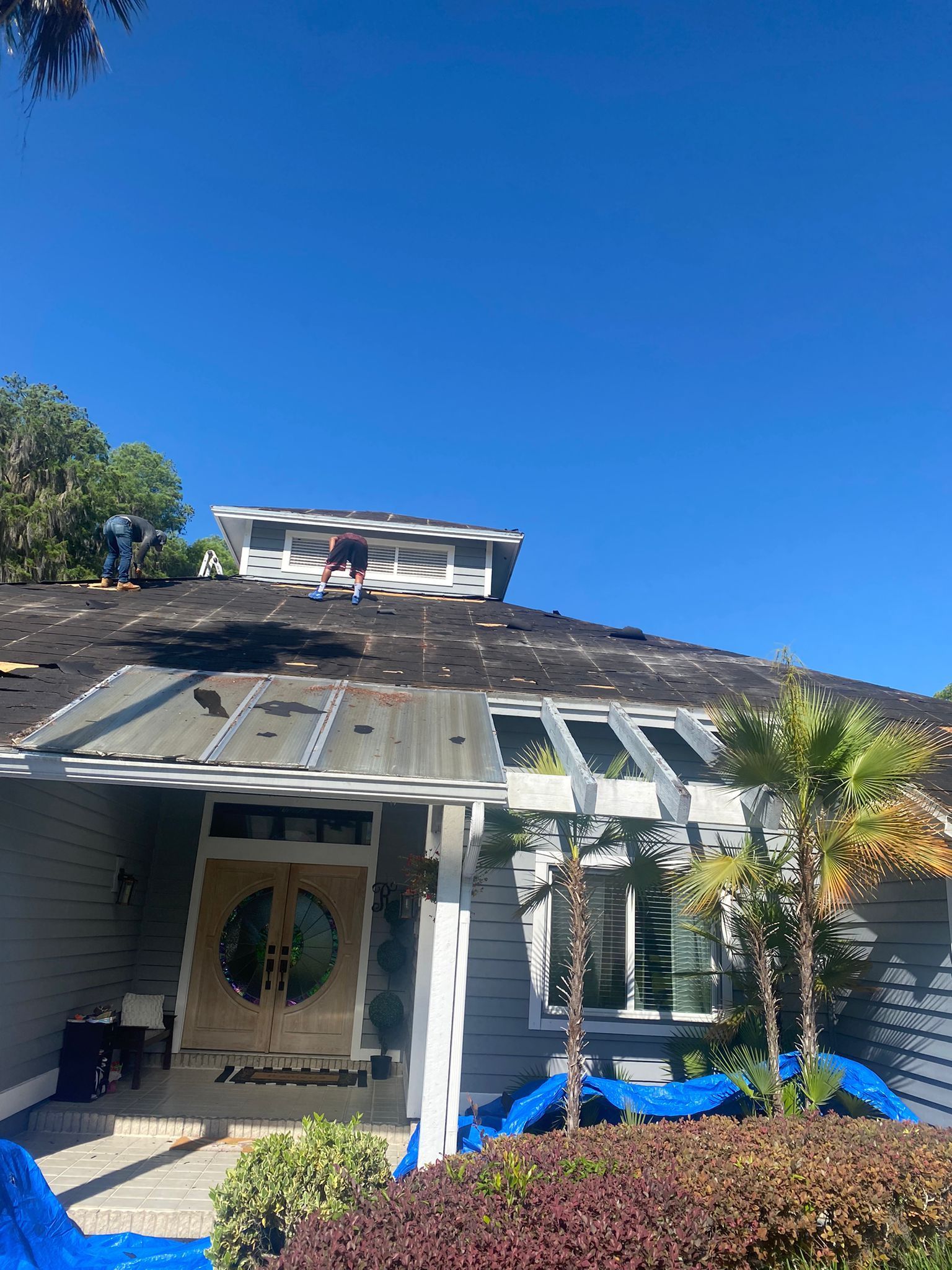 People on Roof Repair — Tampa, FL — Yowell’s Roofing
