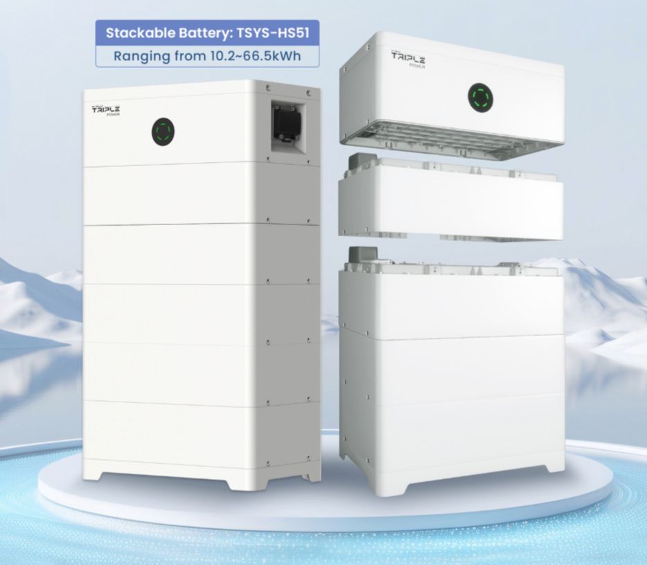 White, stackable solar battery system with one unit partially disassembled against a snowy mountain backdrop.