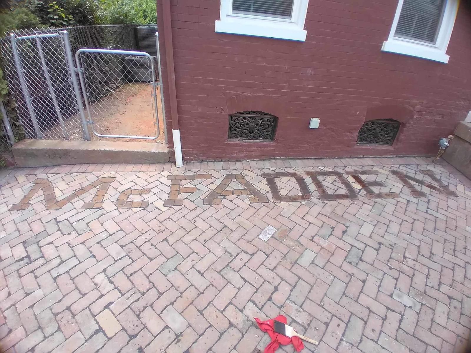 Red brick building in background.