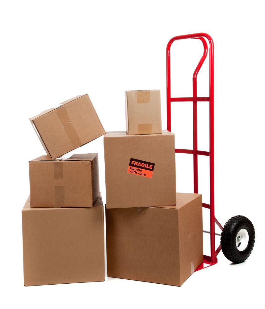 A stack of cardboard boxes with fragile written on them — Town & Country Removals In Port Macquarie, NSW