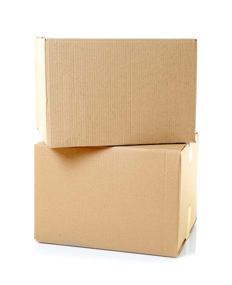 Two Cardboard Boxes Are Stacked on Top of Each Other on A White Background — Town & Country Removals In Port Macquarie, NSW