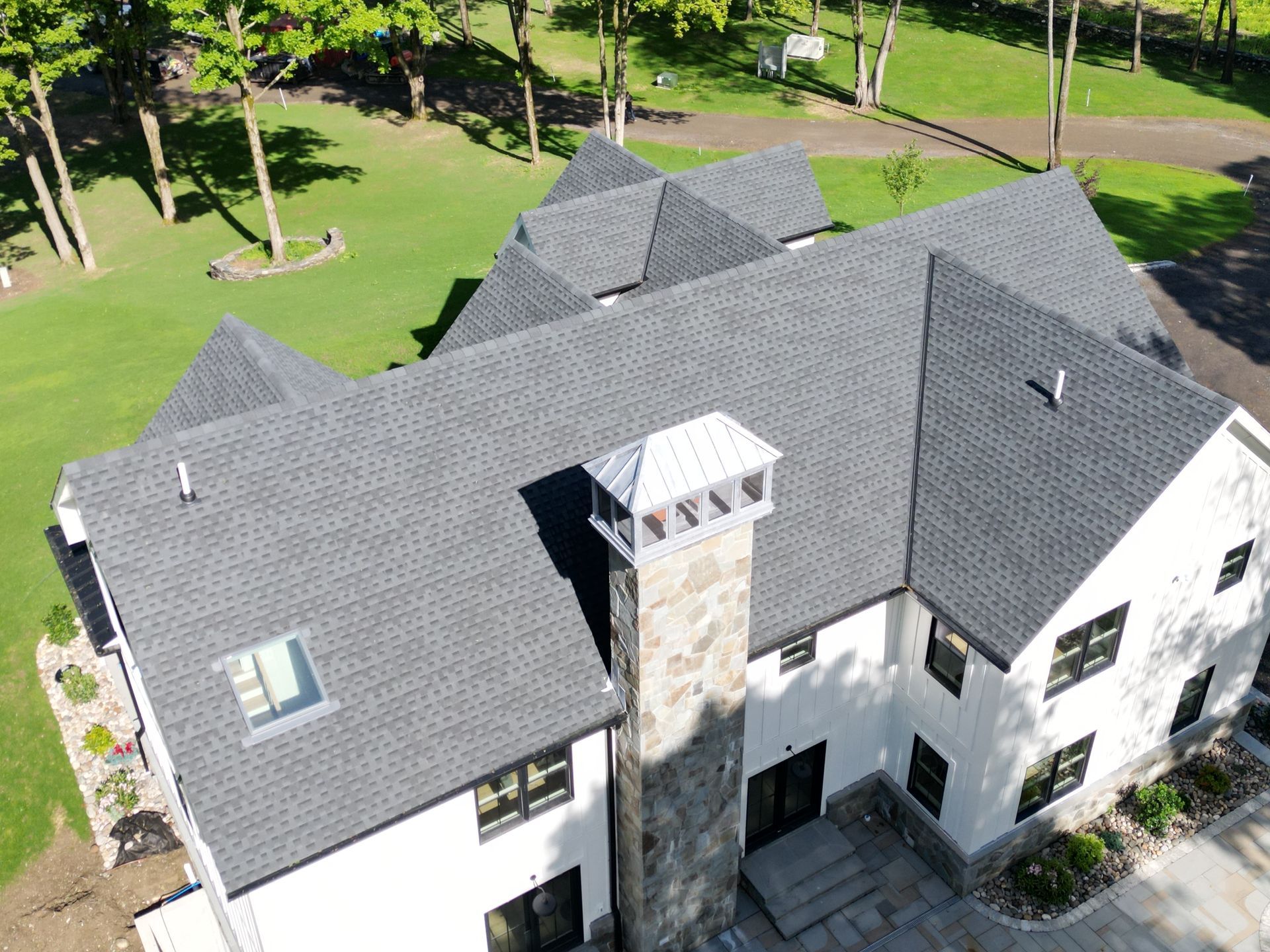 Aerial view of a new asphalt roof