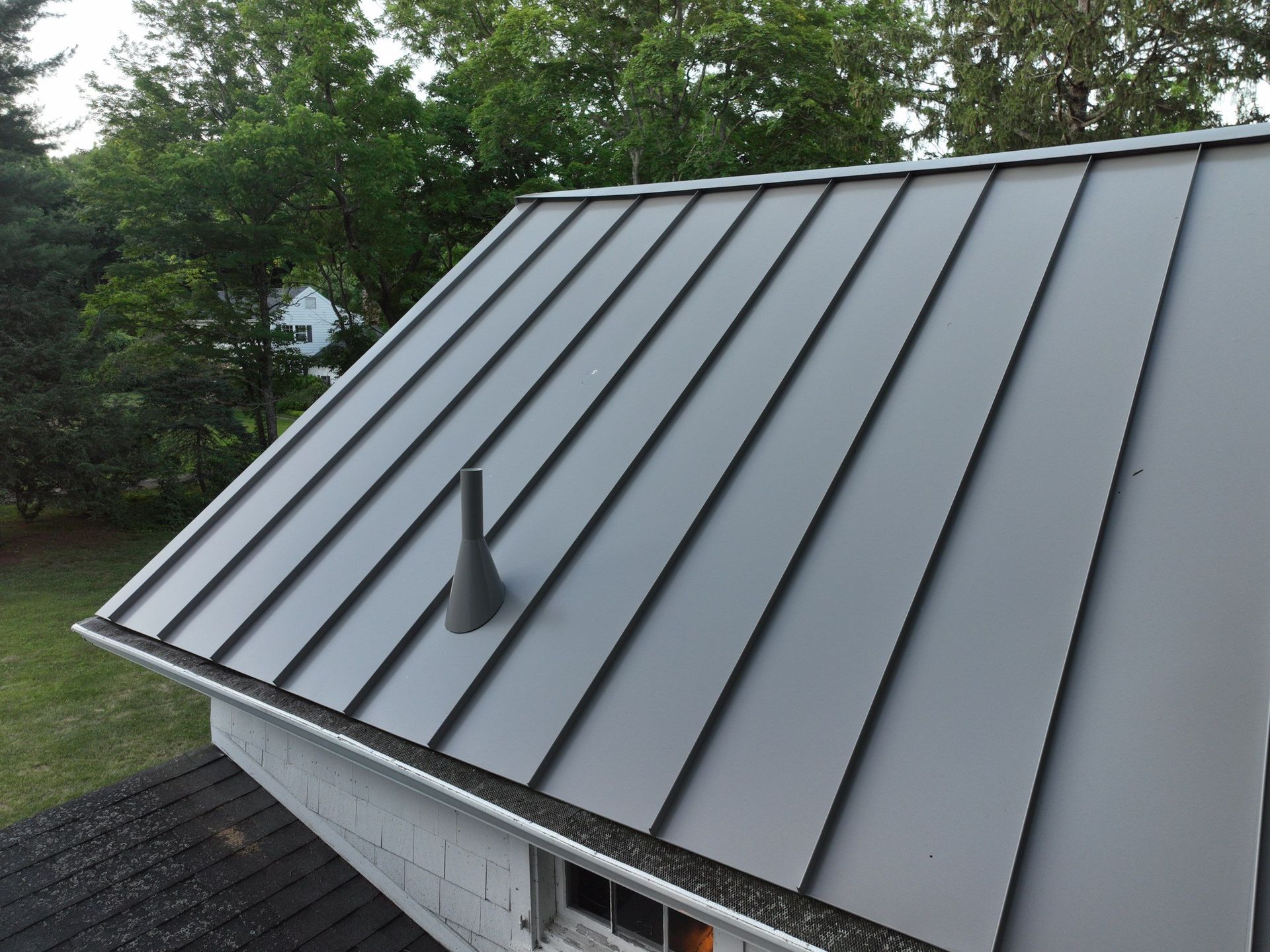 Close up of gray metal roof replacement