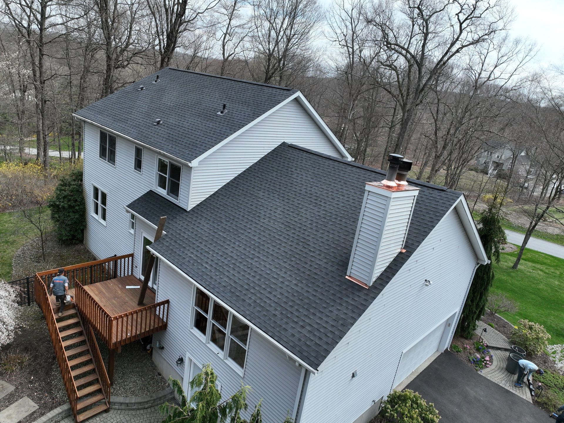A large apartment building with a flat roof replacement