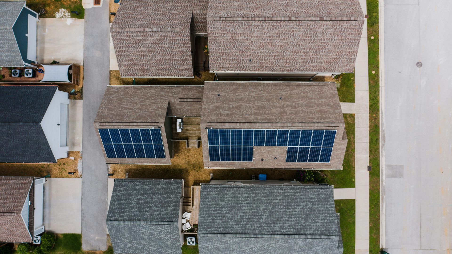 A large apartment building with a flat roof replacement