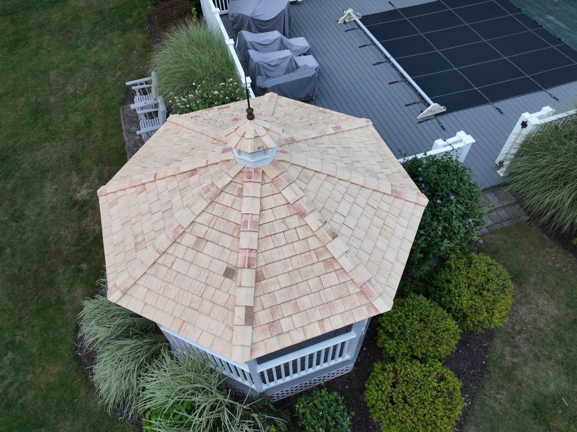 An aerial view of a gazebo with a cedar roof installation
