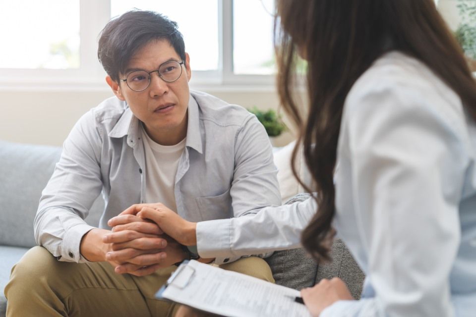 male consulting with psychologist,