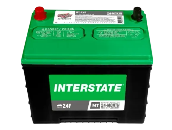 Green and black Interstate car battery with red and black terminals, white background.