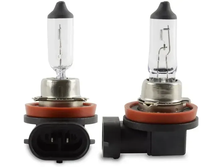 Two car headlight bulbs with black plastic bases and orange rubber seals.