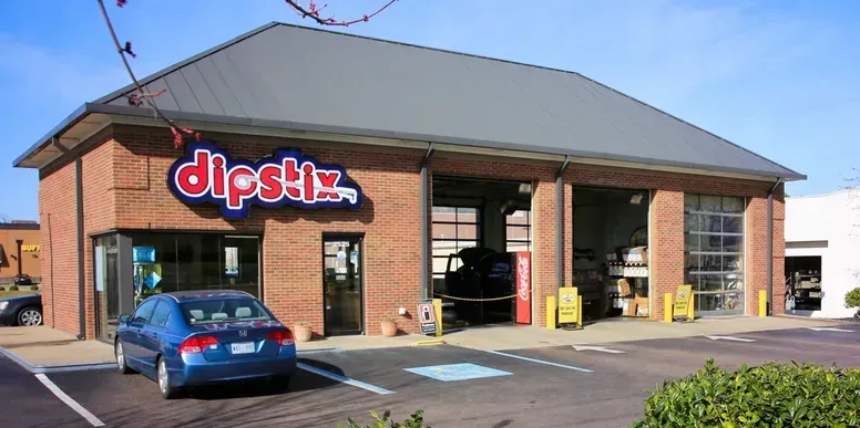 Exterior shot of a brick auto repair shop, 
