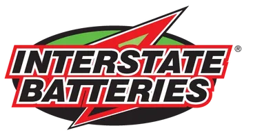 Interstate Batteries logo: bold white text on a red and black starburst, green oval backdrop.