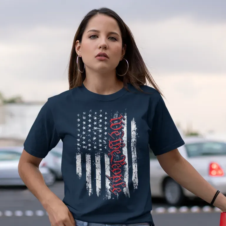 A woman is wearing a t-shirt that says we the people on it.
