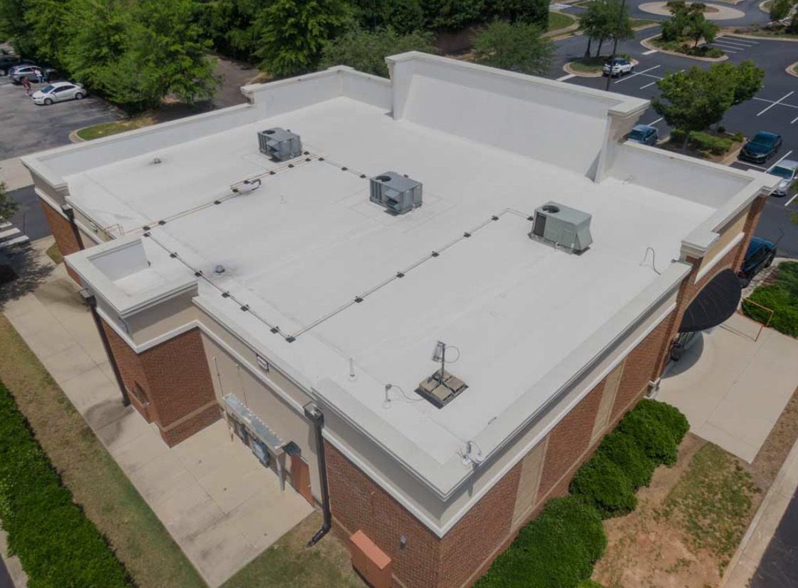 A row of electrical panels in a room with a brick wall