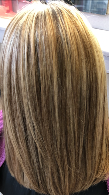 woman showing her long colored hair