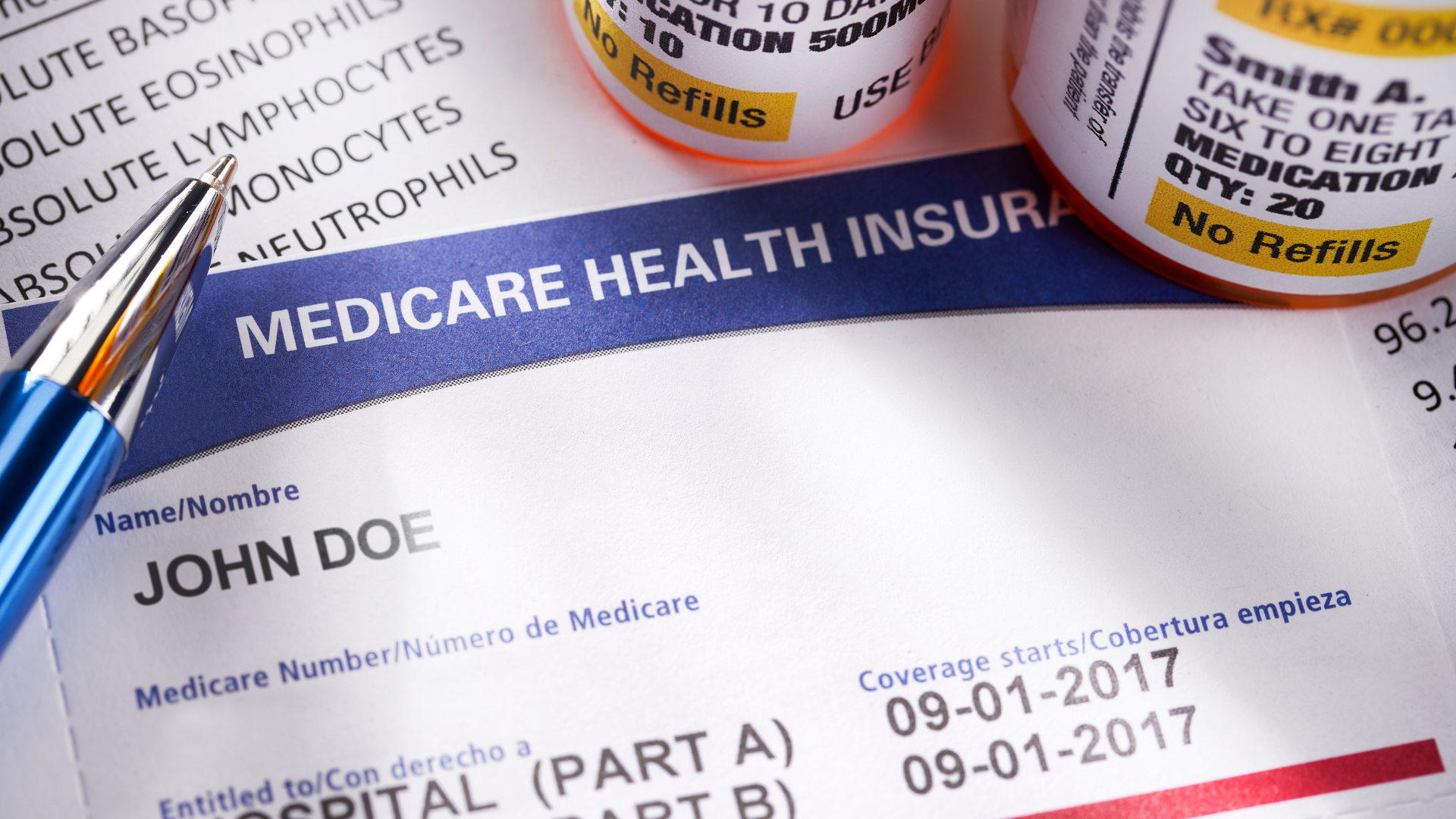 A pen sits on top of a medicare health insurance form