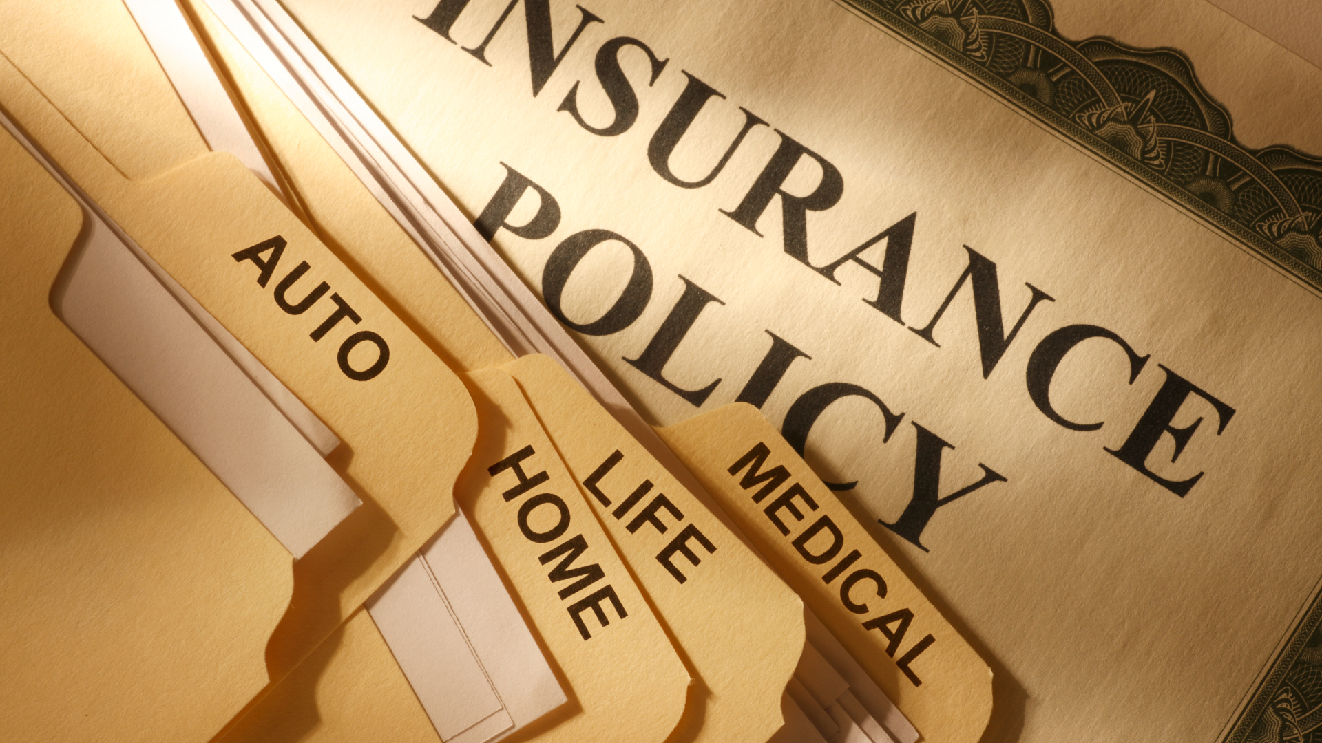 The word insurance is on a piece of paper