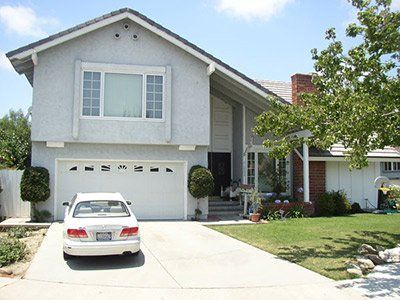 Car in front of house - Cypress, CA - Gibson Realty