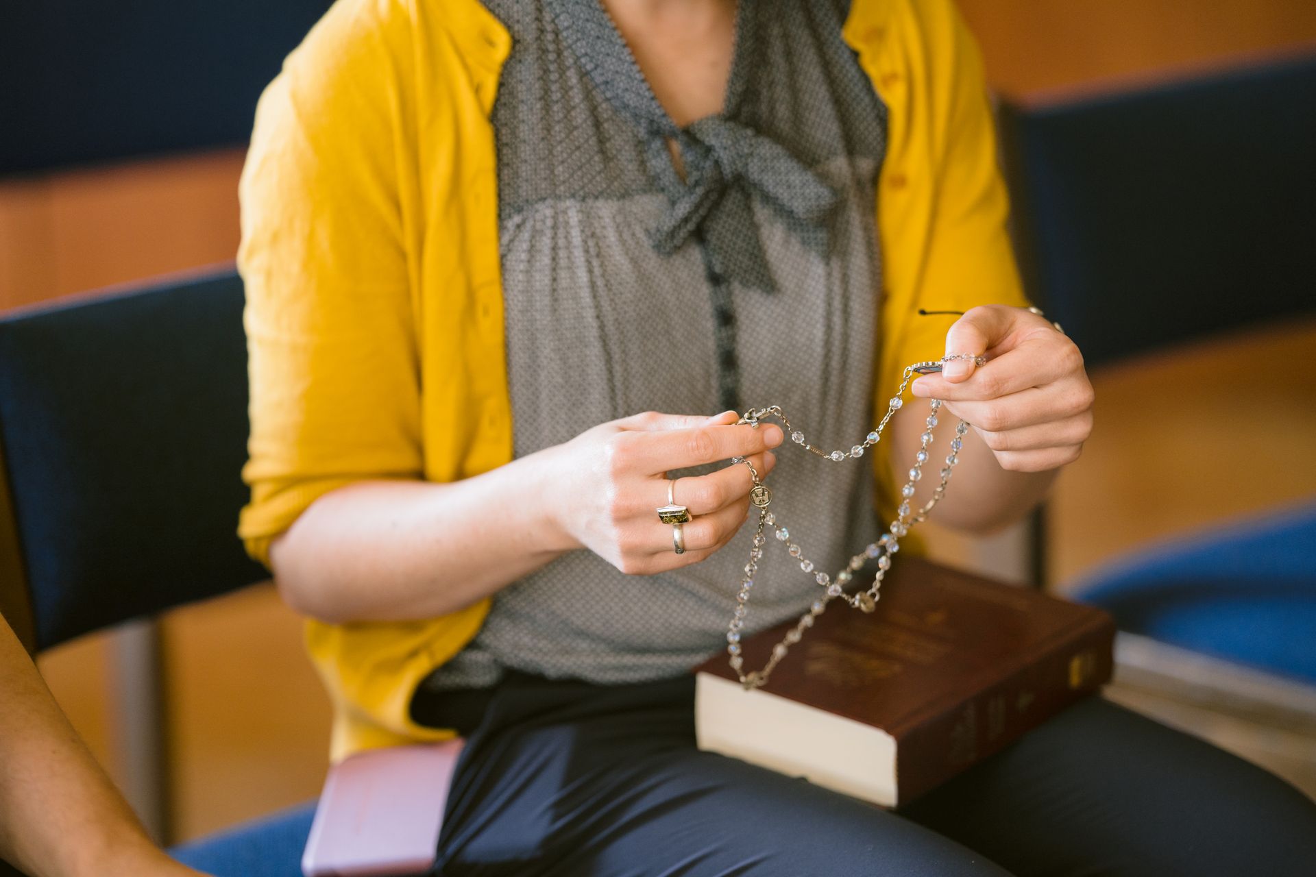 Parishioner prepares for the rosary.