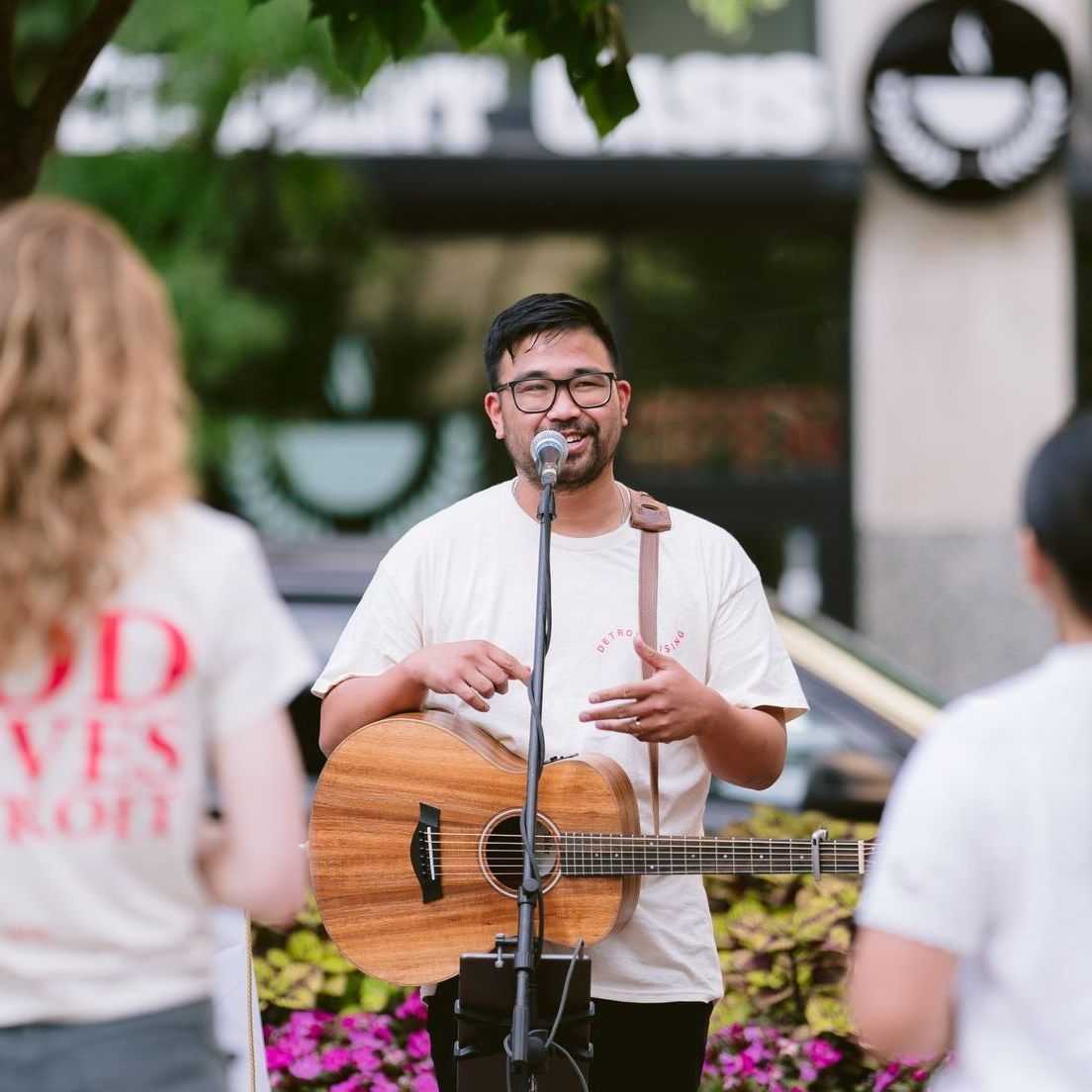 Parishioner singing before other volunteers.