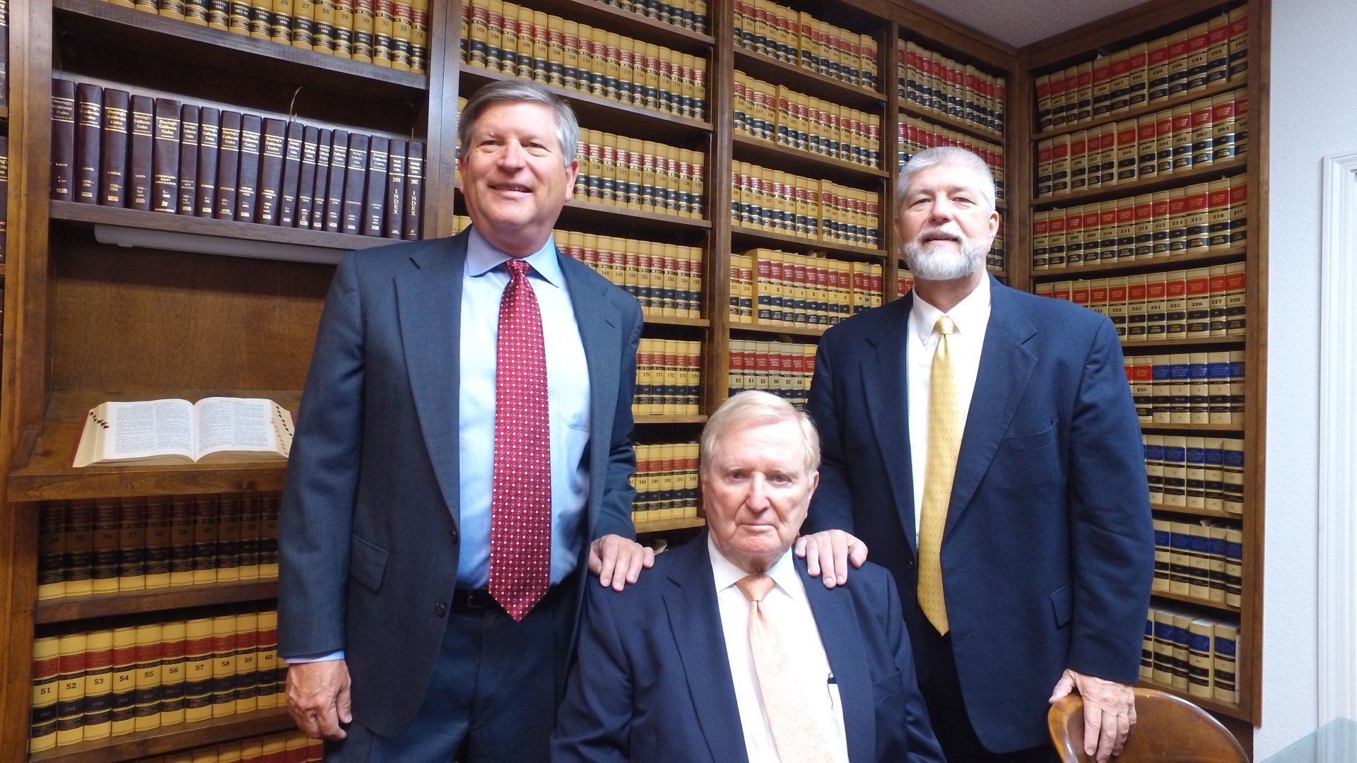 Photograph of the Picking Law corporation attorneys in the Pickering Law office library 