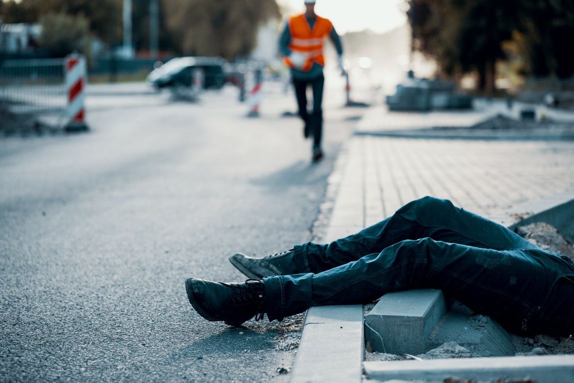 Image Of A Person Fallen Down On A Side Walk Construction Site Getting A  Personal Injury. Image Show On Pickering Law Corporation Website On Personal Injury Workers Compensation Page In Redding CA