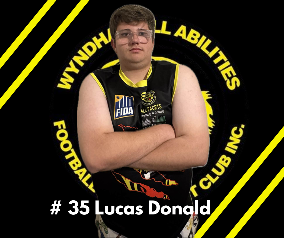 Lucas Donald, player number 35, stands with arms crossed wearing a black and yellow Wyndham All Abilities jersey.