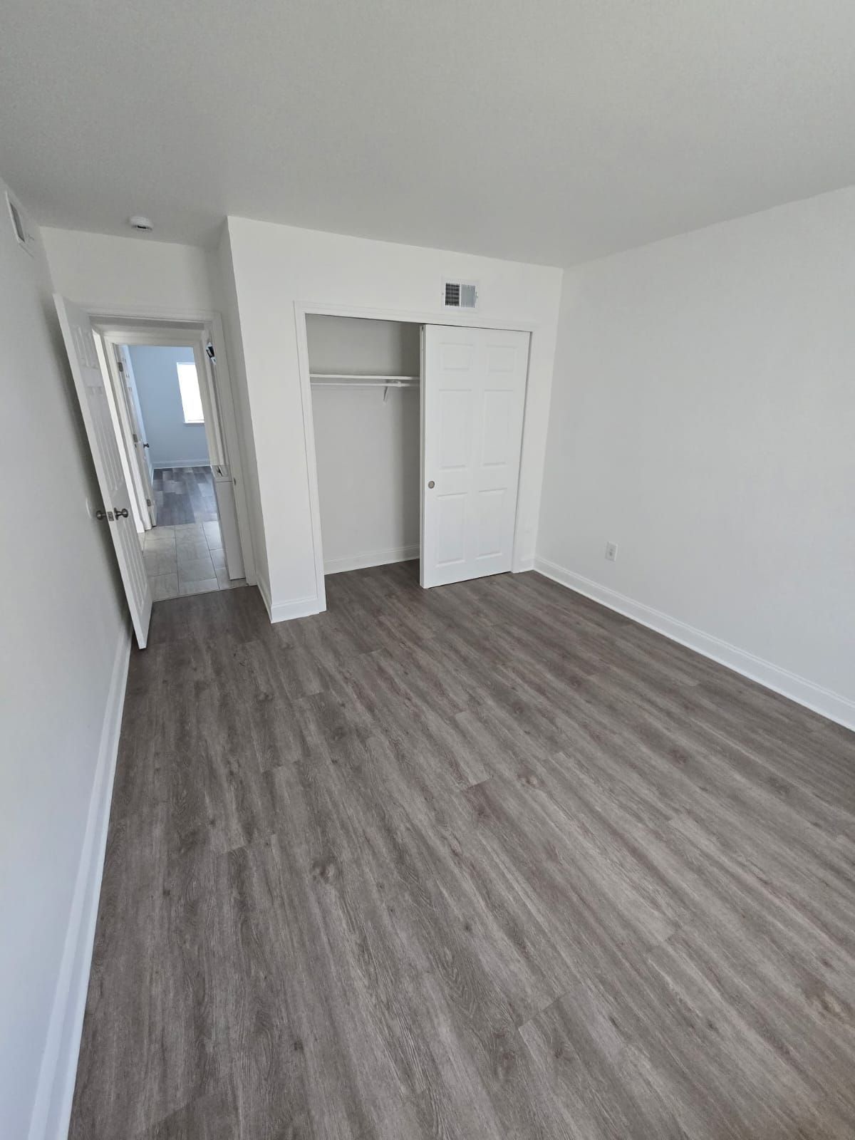 Bedroom interior with closet and clean white finish at Chateau Apartments Burlington, NJ