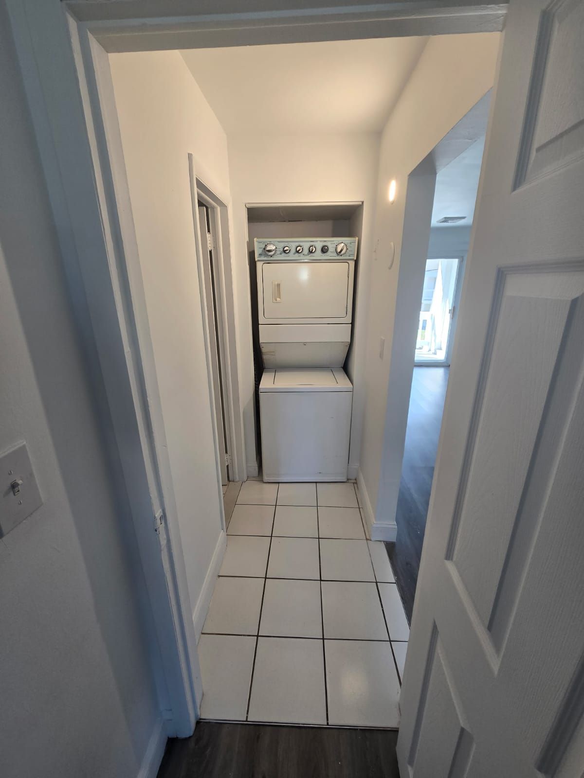 Laundry area with washer and dryer setup inside apartment at Chateau Apartments Burlington, NJ