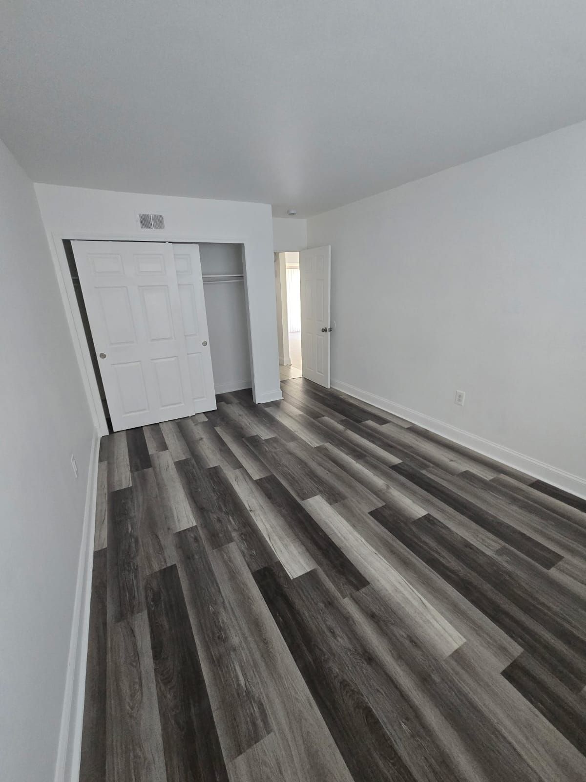 Spacious bedroom with closet and white finish at Chateau Apartments Burlington, NJ