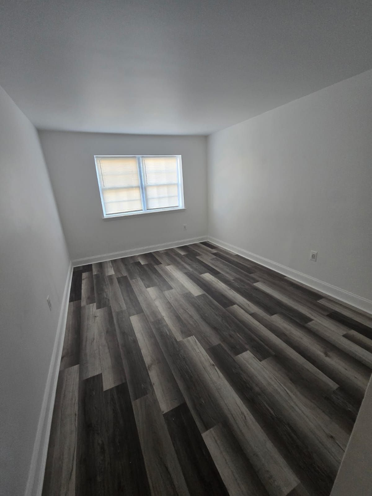 Cozy bedroom with natural light and minimalist design at Chateau Apartments Burlington, NJ