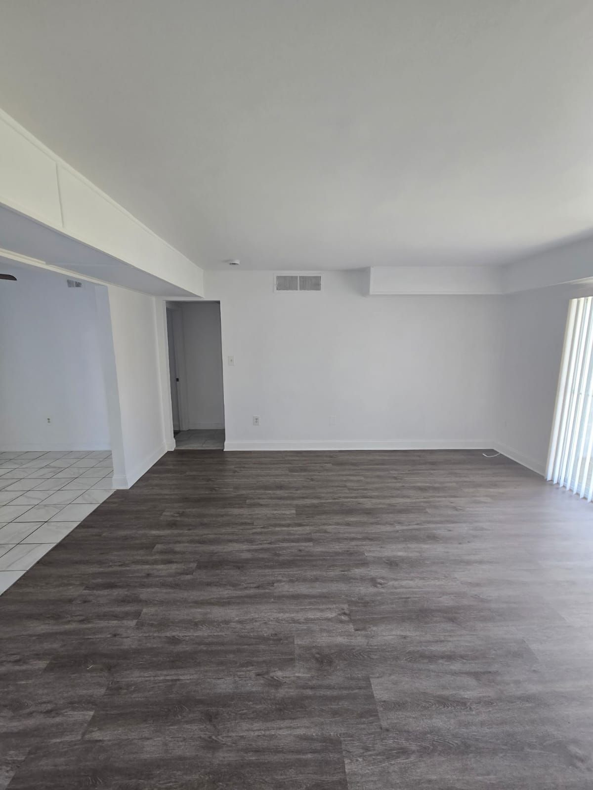 Living room interior with light walls and open layout at Chateau Apartments Burlington, NJ
