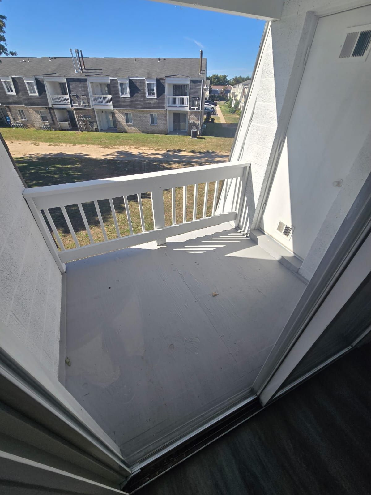 Bright bedroom with natural light and neutral walls at Chateau Apartments Burlington, NJ