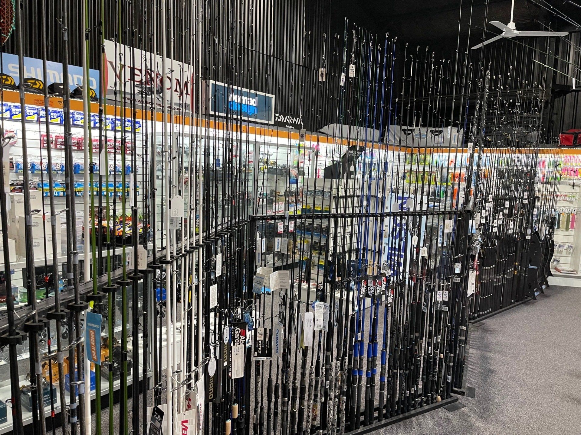 fishing rods in store on rack