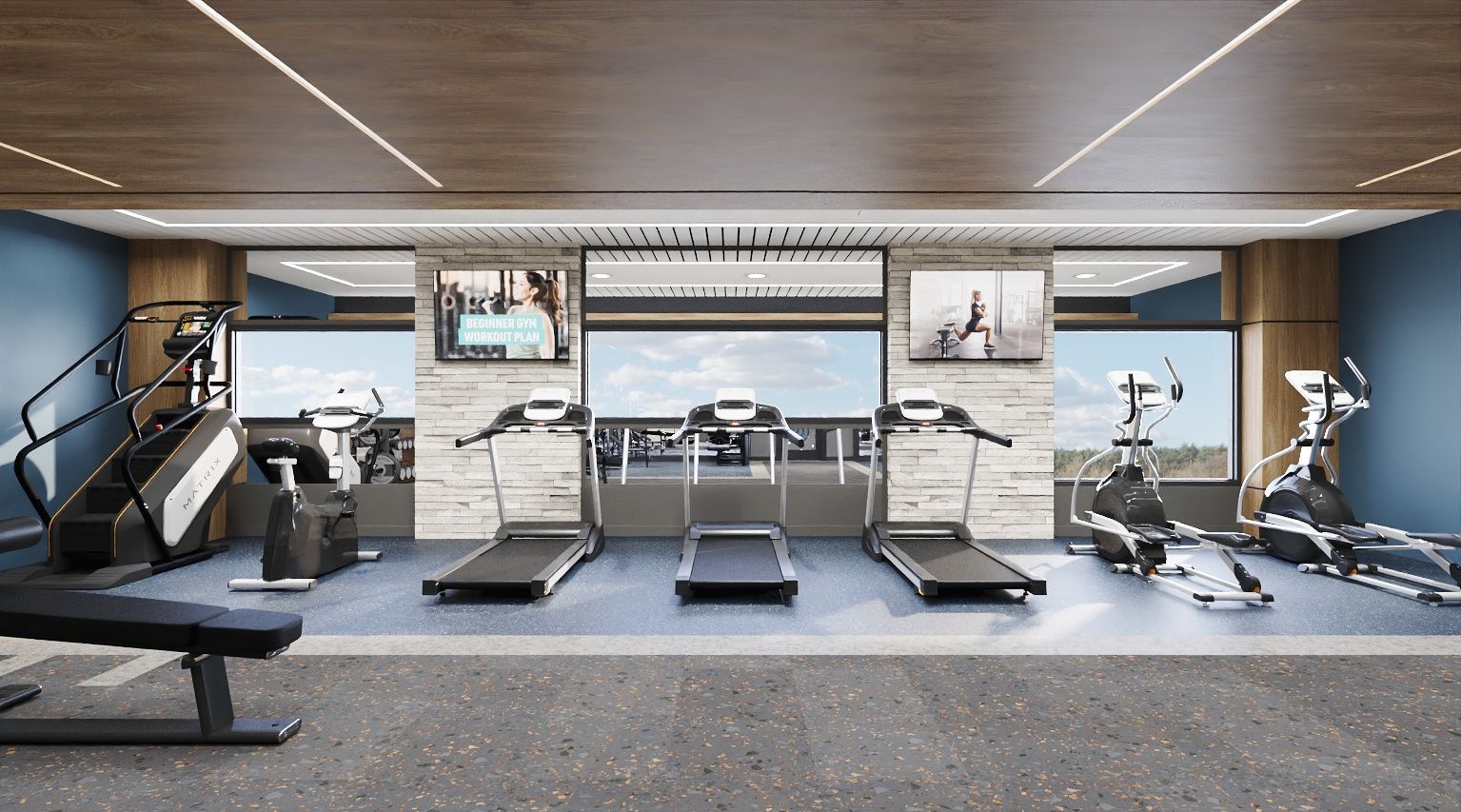 Modern apartment gym with treadmills, ellipticals, and a stair climber along a stone wall at The Astra Benders Landing, offers apartments near The Woodlands, TX.