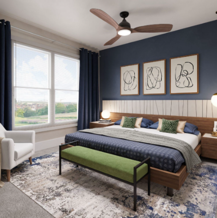 Bedroom with blue wall, wooden bed, green bench, and abstract art at The Astra Benders Landing.