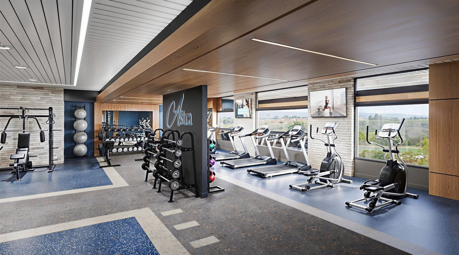 A modern gym interior with weight machines, treadmills, and exercise equipment. Light blue and gray color scheme, large windows.