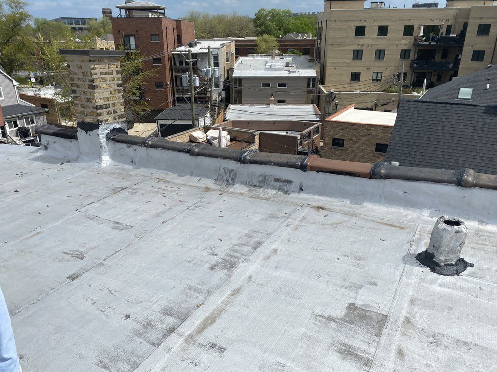 The roof of a building with a chimney on it