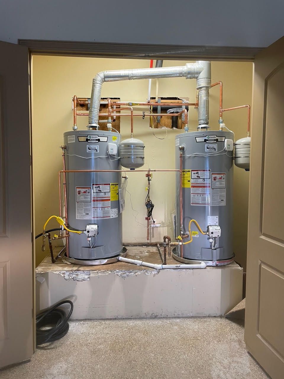 A room with two water heaters in it