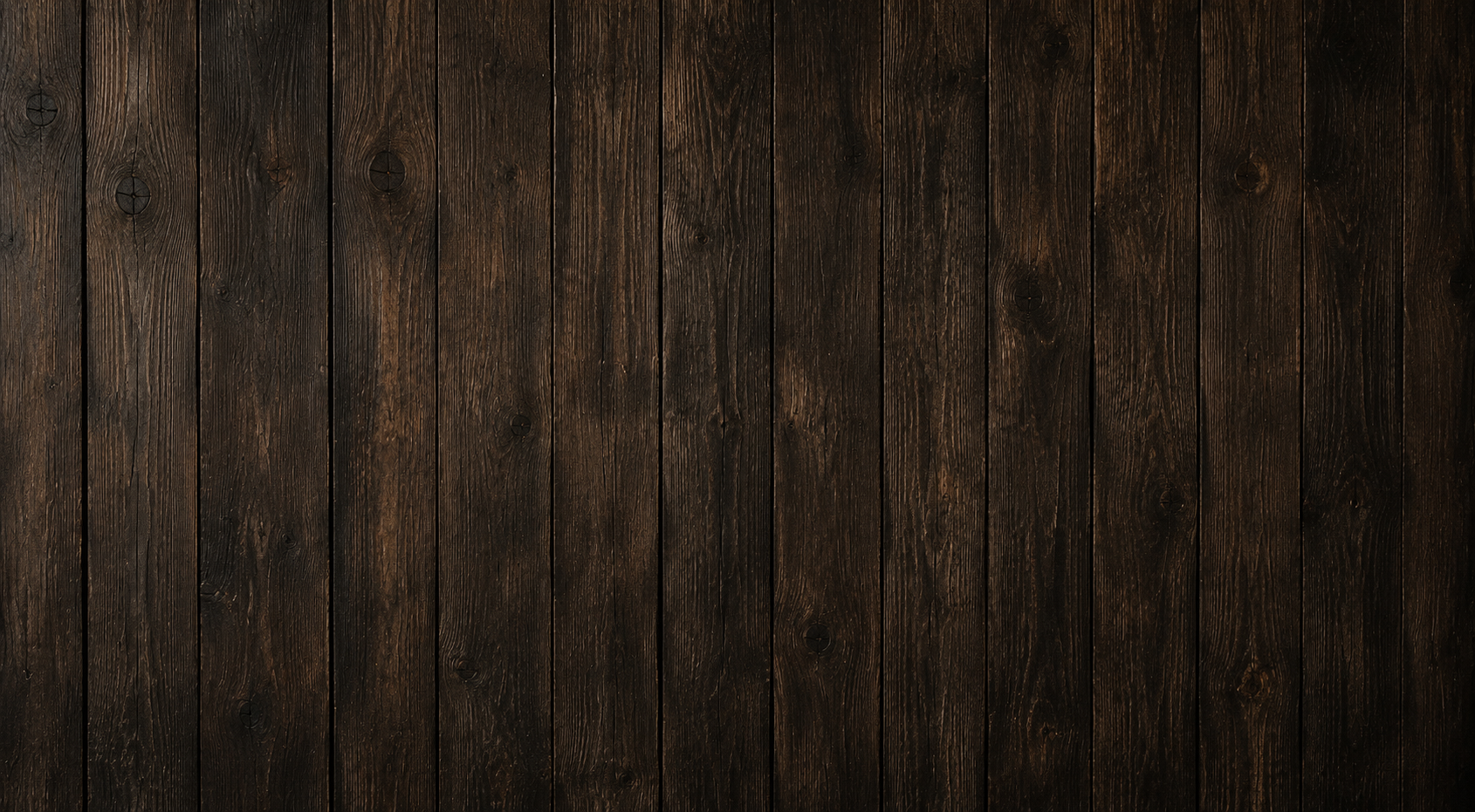 Dark brown weathered wooden planks forming a rustic background