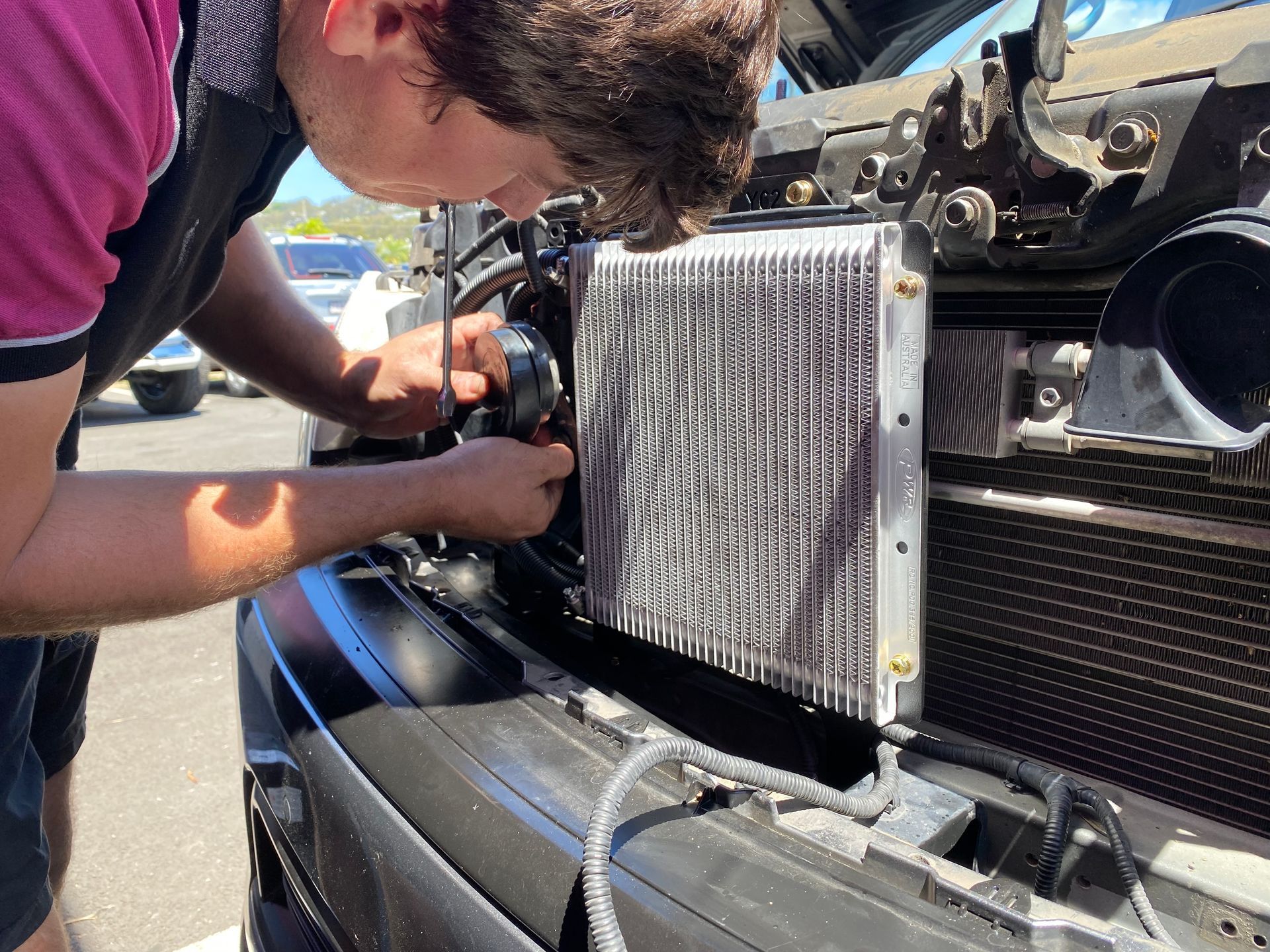 A Person is Working on the Engine of a Car — Rycam Automotive in Buderim, QLD