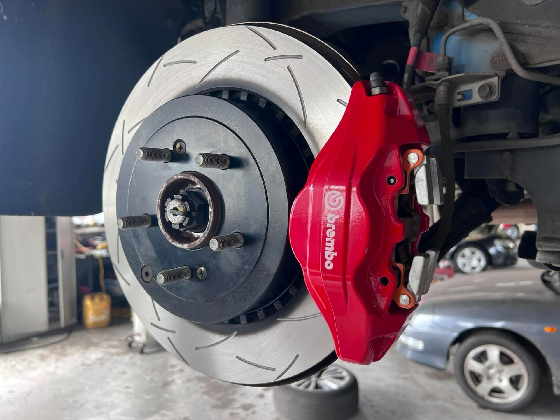 A Mechanic is Working on the Engine of a Car in a Garage — Rycam Automotive in Buderim, QLD