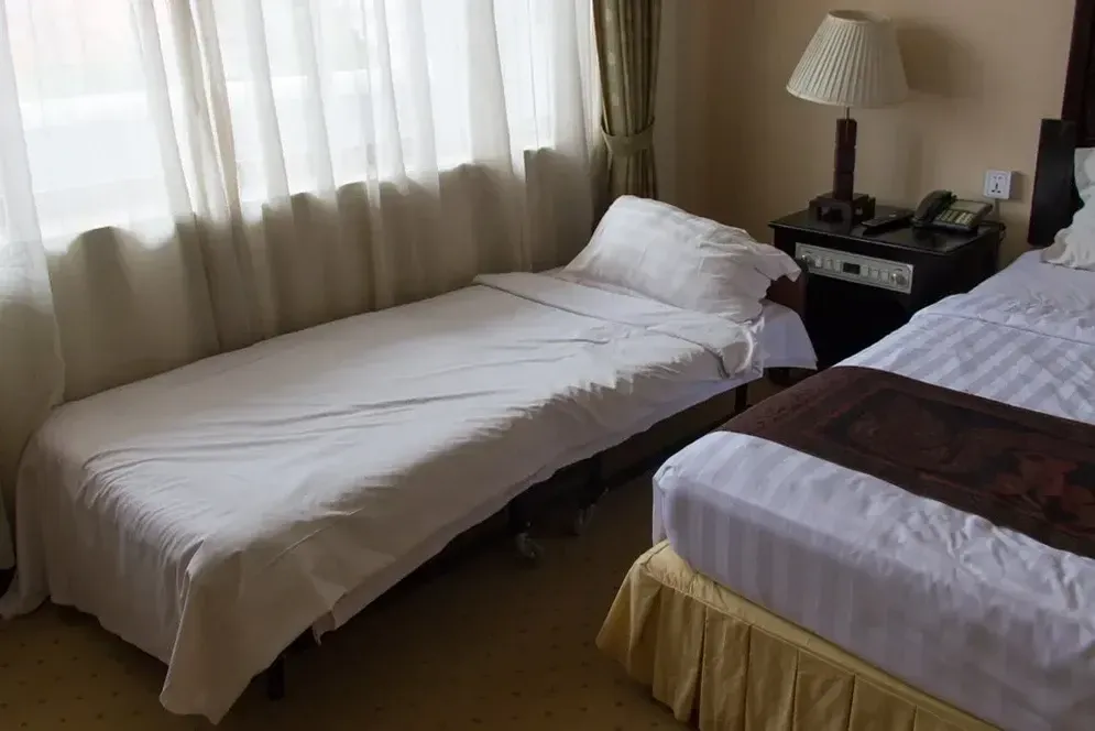 A Hotel Room With Two Beds and a Lamp — Hire All in Tugun, QLD