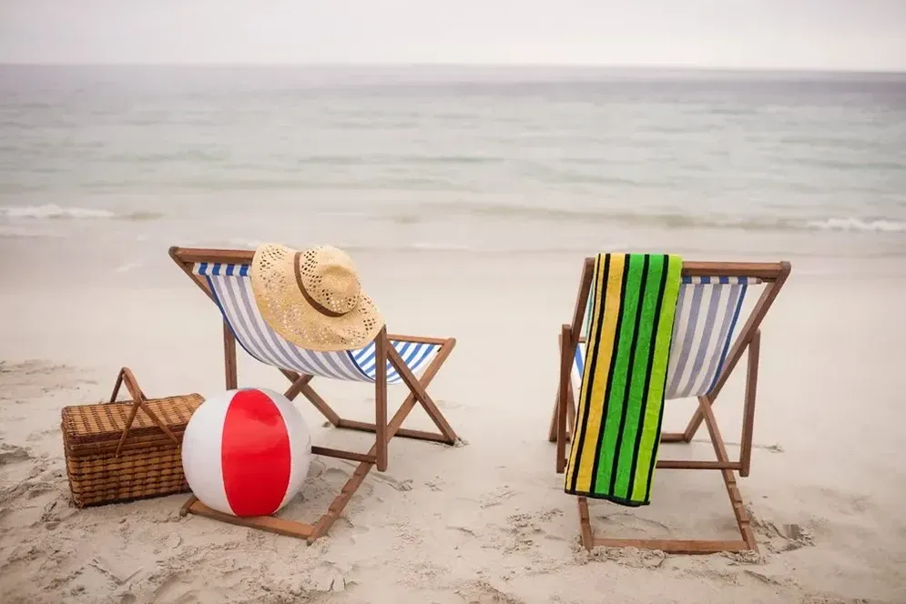 Two Beach Chairs, a Hat, a Beach Ball and a Towel on the Beach — Hire All in Tugun, QLD