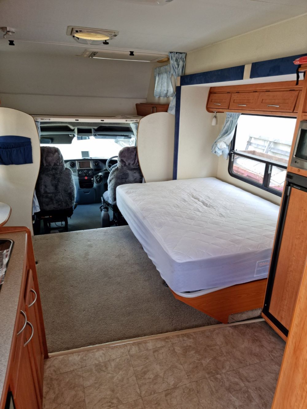 The Inside of a Rv With a Bed and a Mattress — Dempsters Caravan & RV in Thabeban, QLD