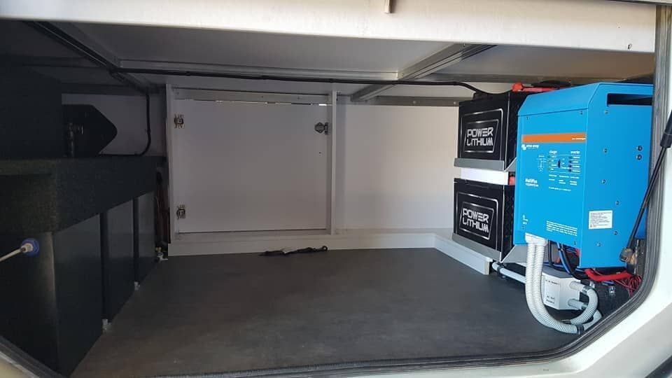 A Blue Battery Pack is in a Caravan — Dempsters Caravan & RV in Rockhampton, QLD