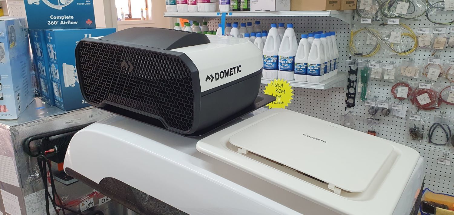 A Projector is Sitting on Top of a Table in a Store — Dempsters Caravan & RV in Rockhampton, QLD