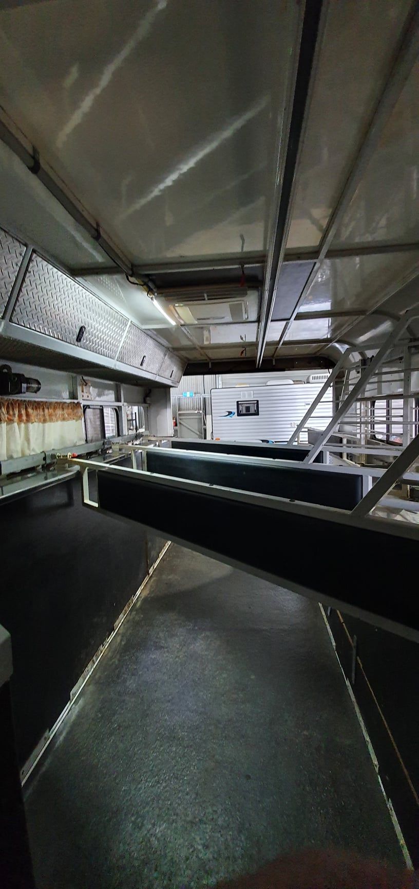 A Large Room With a Lot of Shelves and a Ceiling  — Dempsters Caravan & RV in Gladstone, QLD